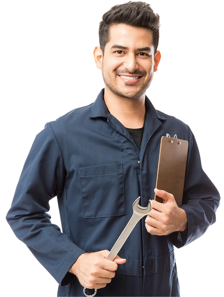 Smiling person in a blue coverall holds a large wrench in one hand and a clipboard in the other.